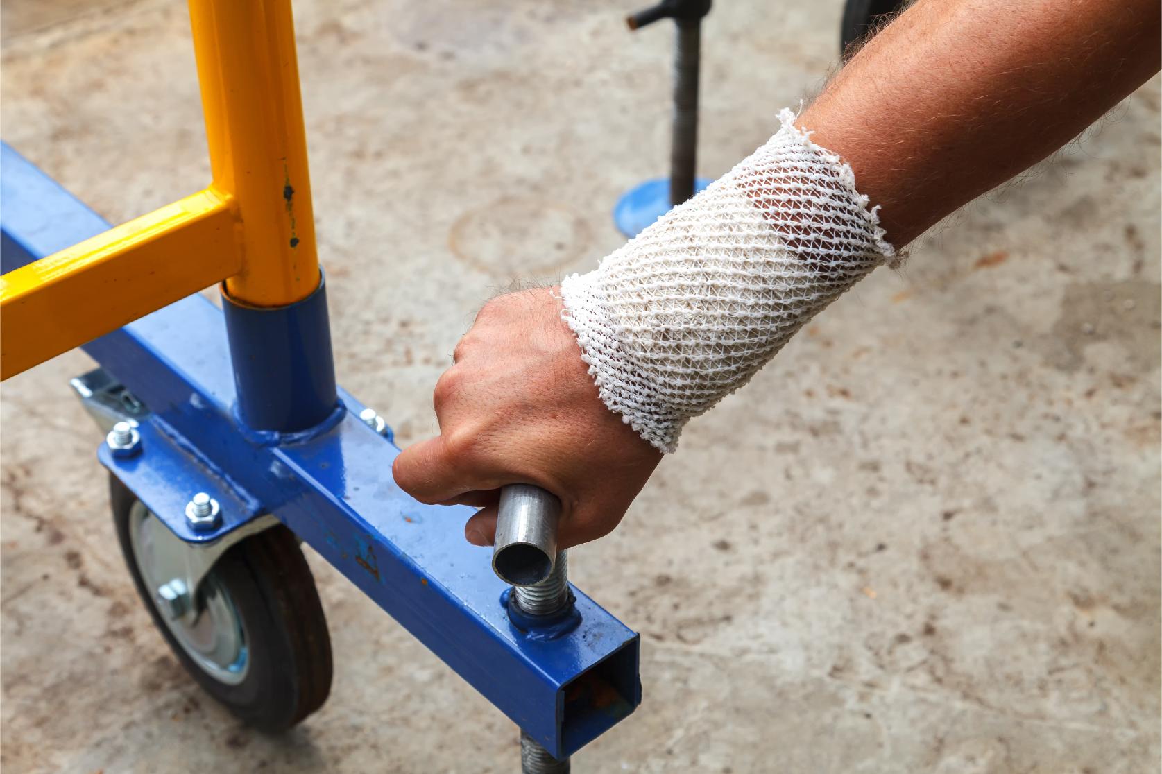 worker-with-a-bandaged-patient-hand-twisting-the-l-2022-11-16-17-26-25-utc